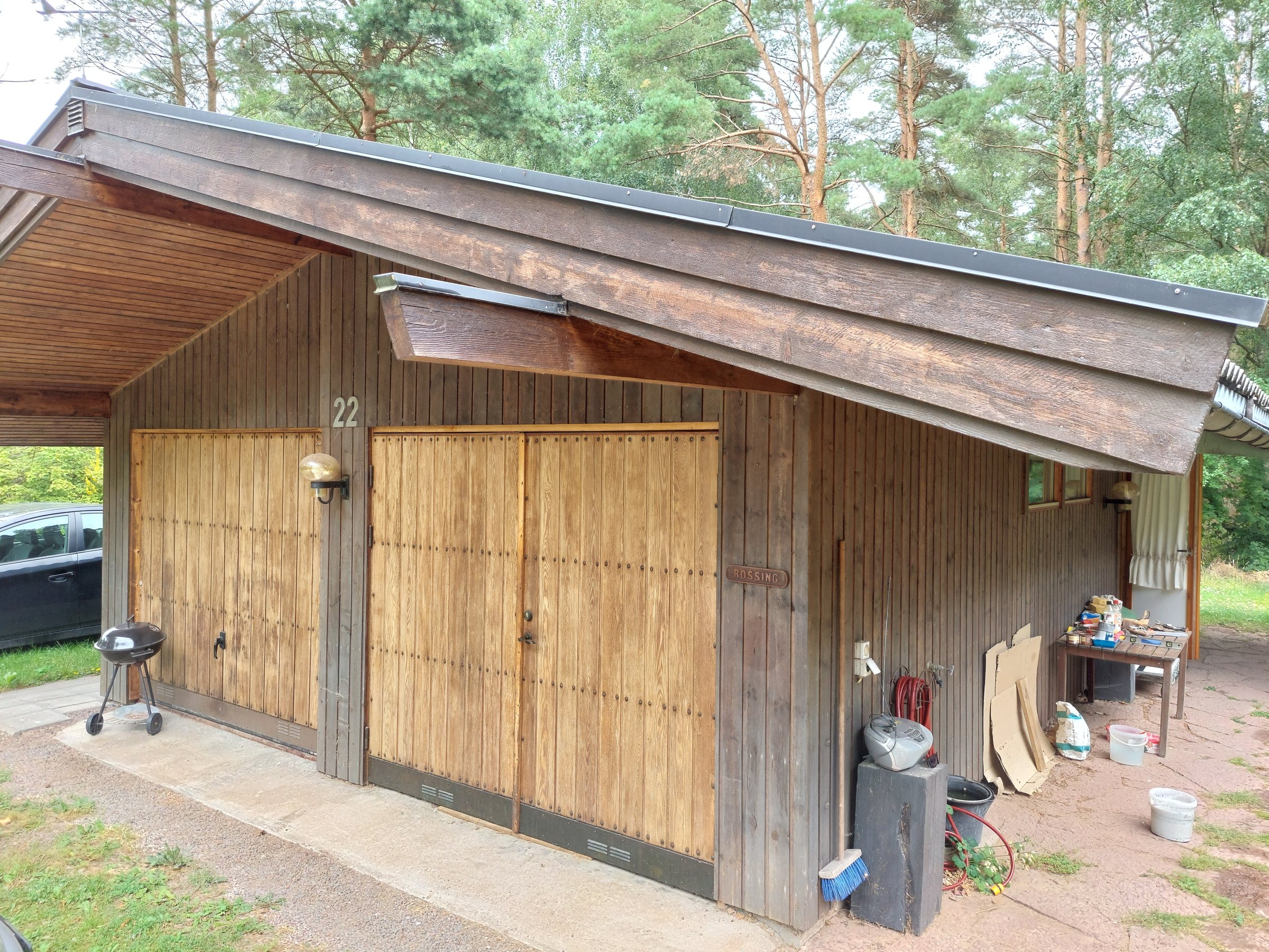 Rear exterior of the villa with wooden staircase and garage level below