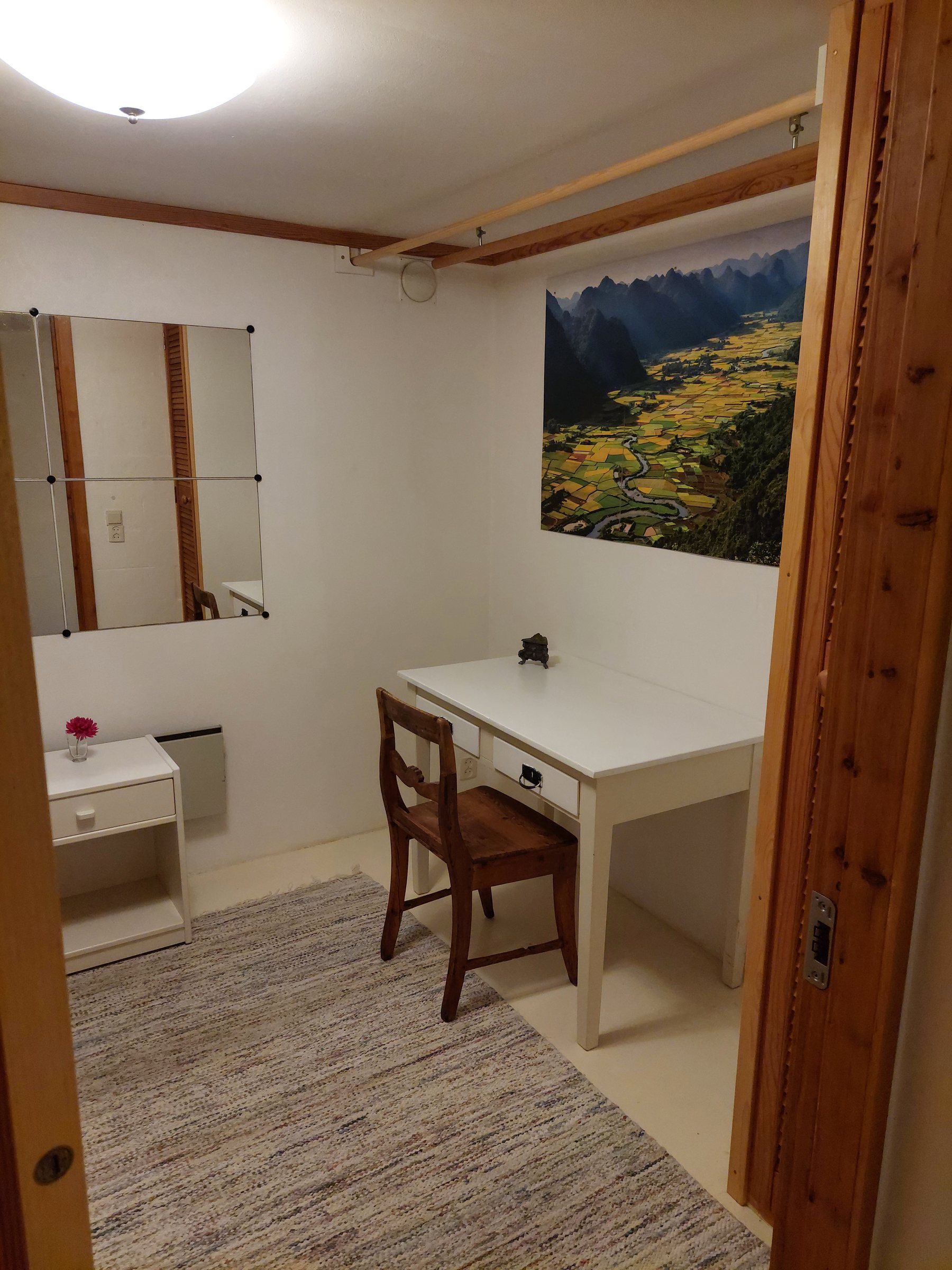 Basement single room with a desk and wardrobe